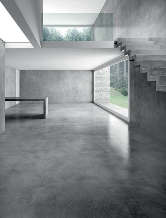 Intérieur contemporain et design avec un sol en béton lissé